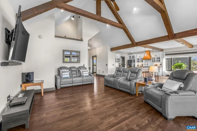 a view of a balcony with wooden floor next to a yard
