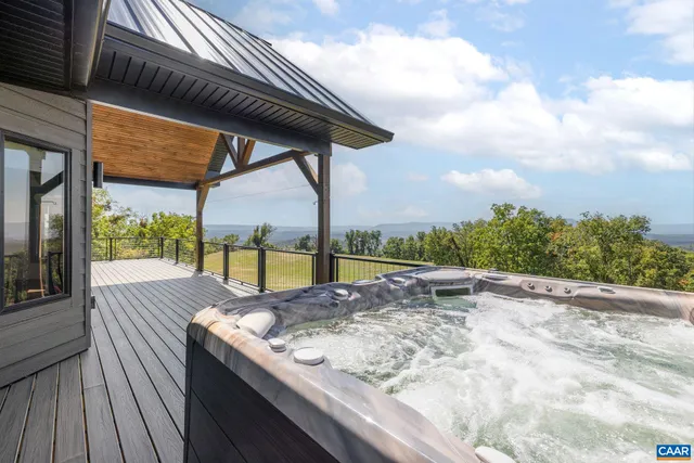a view of a hallway with wooden floor and a white cabinet