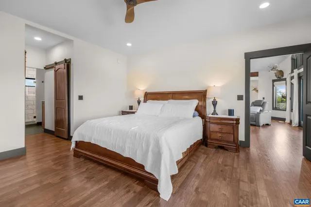a view of hallway with wooden floor