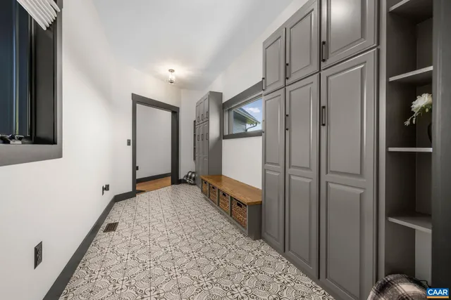 a view of a room with wooden floor and window