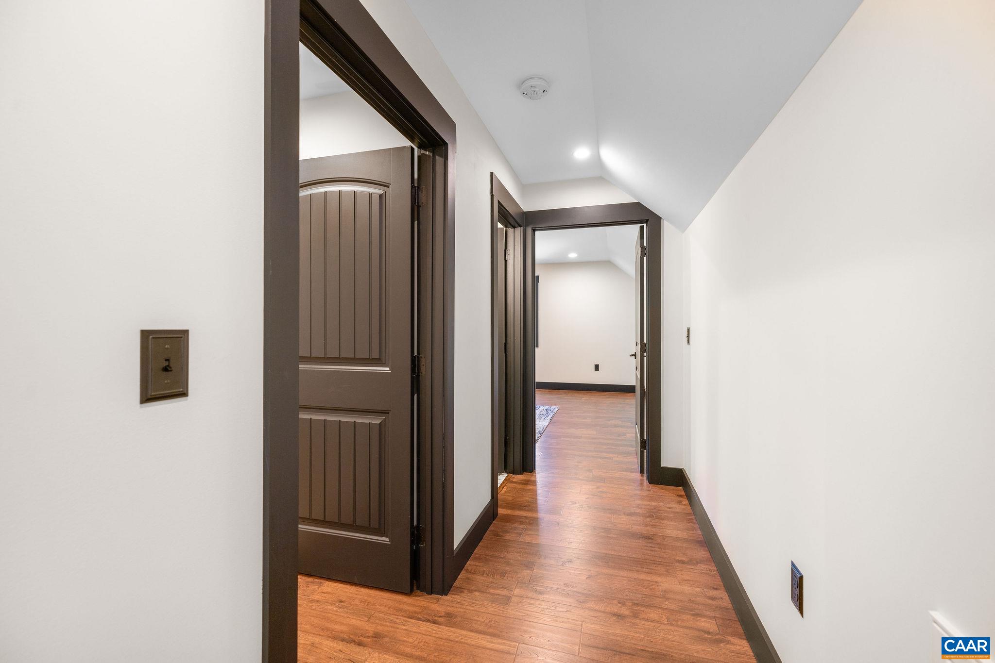 699 Hendrickson Road Pembroke, VA 24136 - Photo 40 of 69 a view of hallway with wooden floor