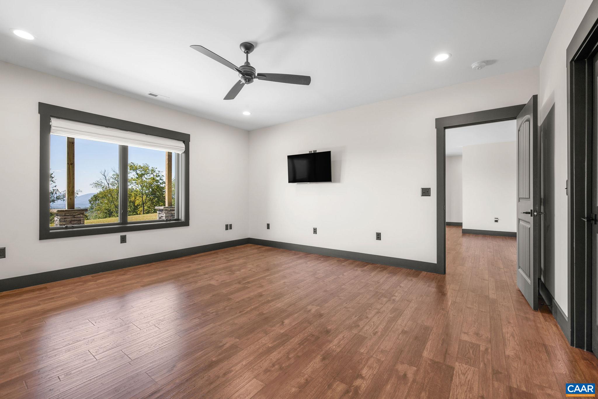 699 Hendrickson Road Pembroke, VA 24136 - Photo 47 of 69 a view of a room with wooden floor and window