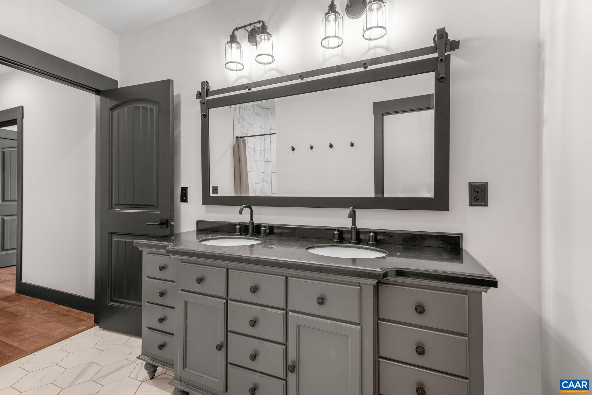 699 Hendrickson Road Pembroke, VA 24136 - Photo 48 of 69 a bathroom with a sink vanity and mirror