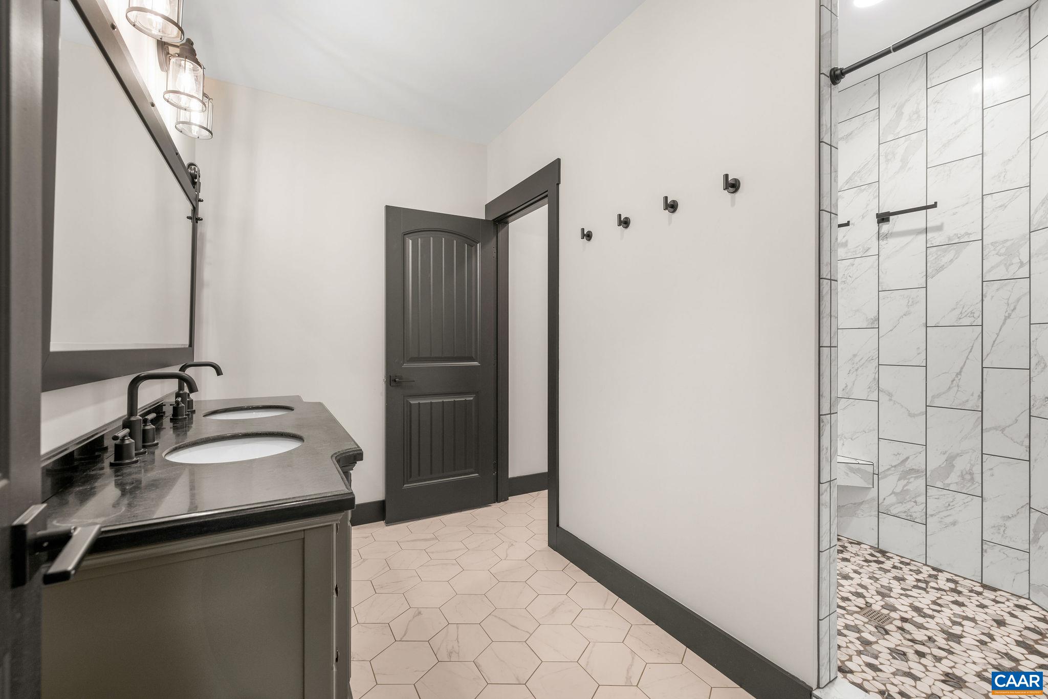 699 Hendrickson Road Pembroke, VA 24136 - Photo 49 of 69 a bathroom with a sink and a mirror