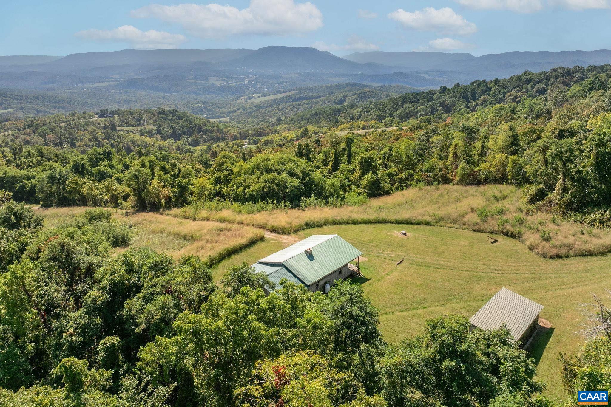 699 Hendrickson Road Pembroke, VA 24136 - Photo 52 of 69 a view of a city with mountains in the background