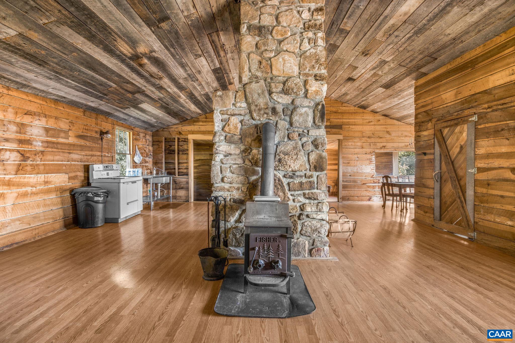 699 Hendrickson Road Pembroke, VA 24136 - Photo 58 of 69 a dining room with furniture wooden floor and windows