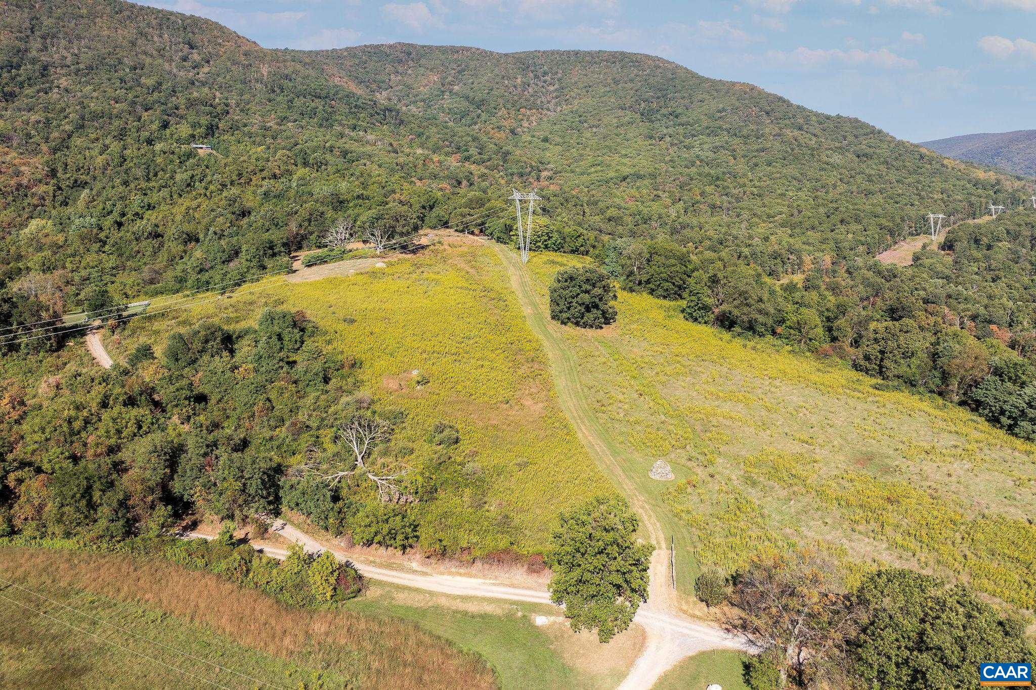 699 Hendrickson Road Pembroke, VA 24136 - Photo 65 of 69 a view of a swimming pool with a mountain in the background