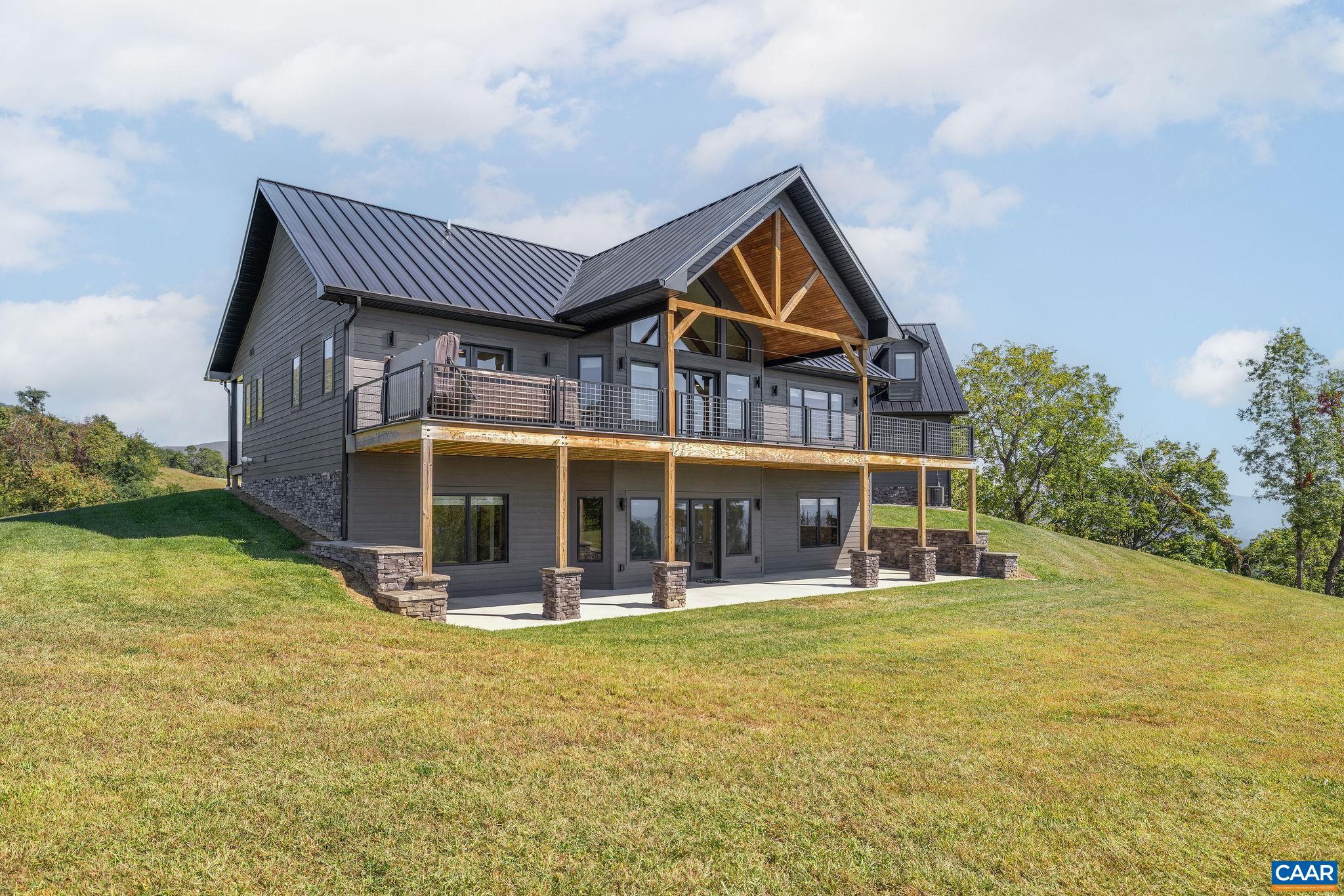 699 Hendrickson Road Pembroke, VA 24136 - Photo 10 of 69 a view of house with outdoor space and sitting area