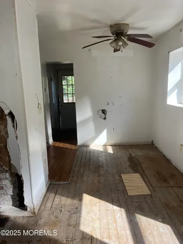 a bathroom with a toilet and a bathtub