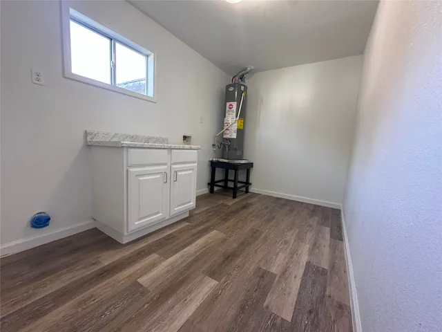 a view of storage and utility room in wooden floor