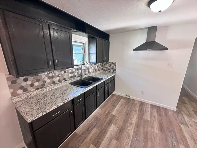 a kitchen with a sink and cabinets