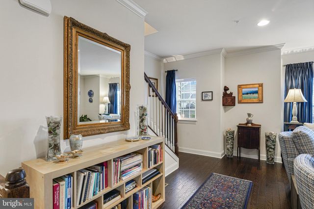 a bedroom with furniture and a book shelf