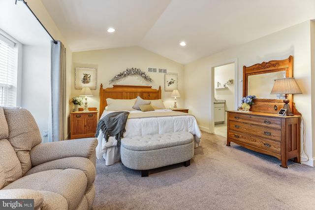 a bedroom with bed and window
