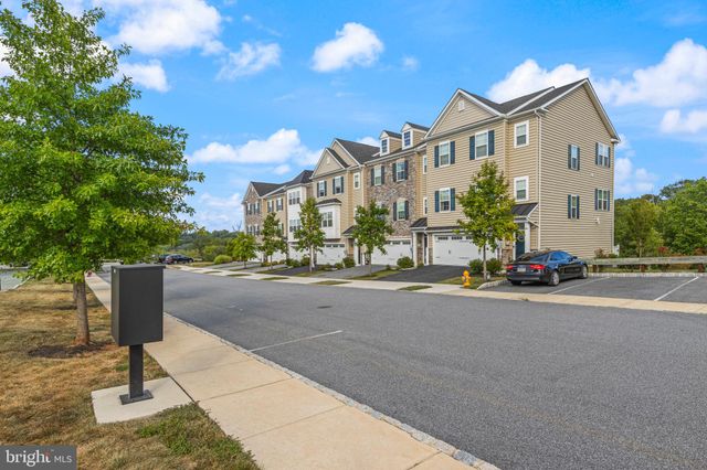 a view of a street with a building in the background