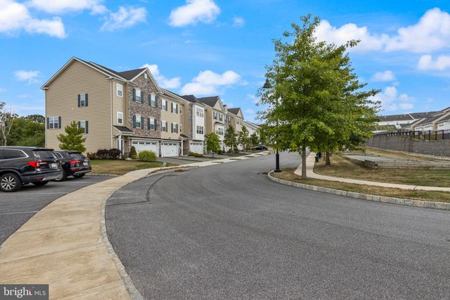 a view of multiple houses with a street