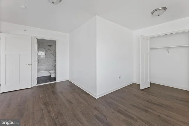 an empty room with wooden floor