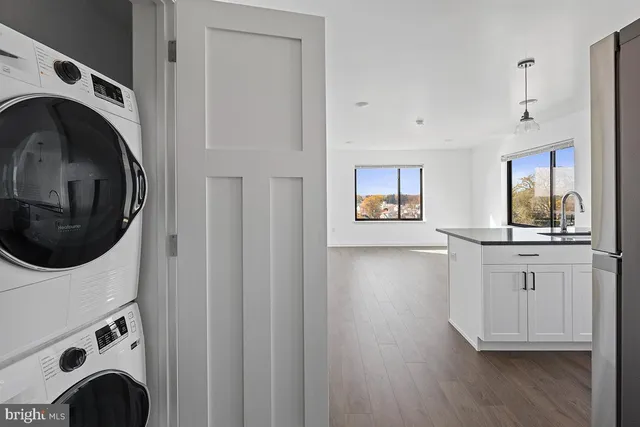 a view of a kitchen with washer and dryer