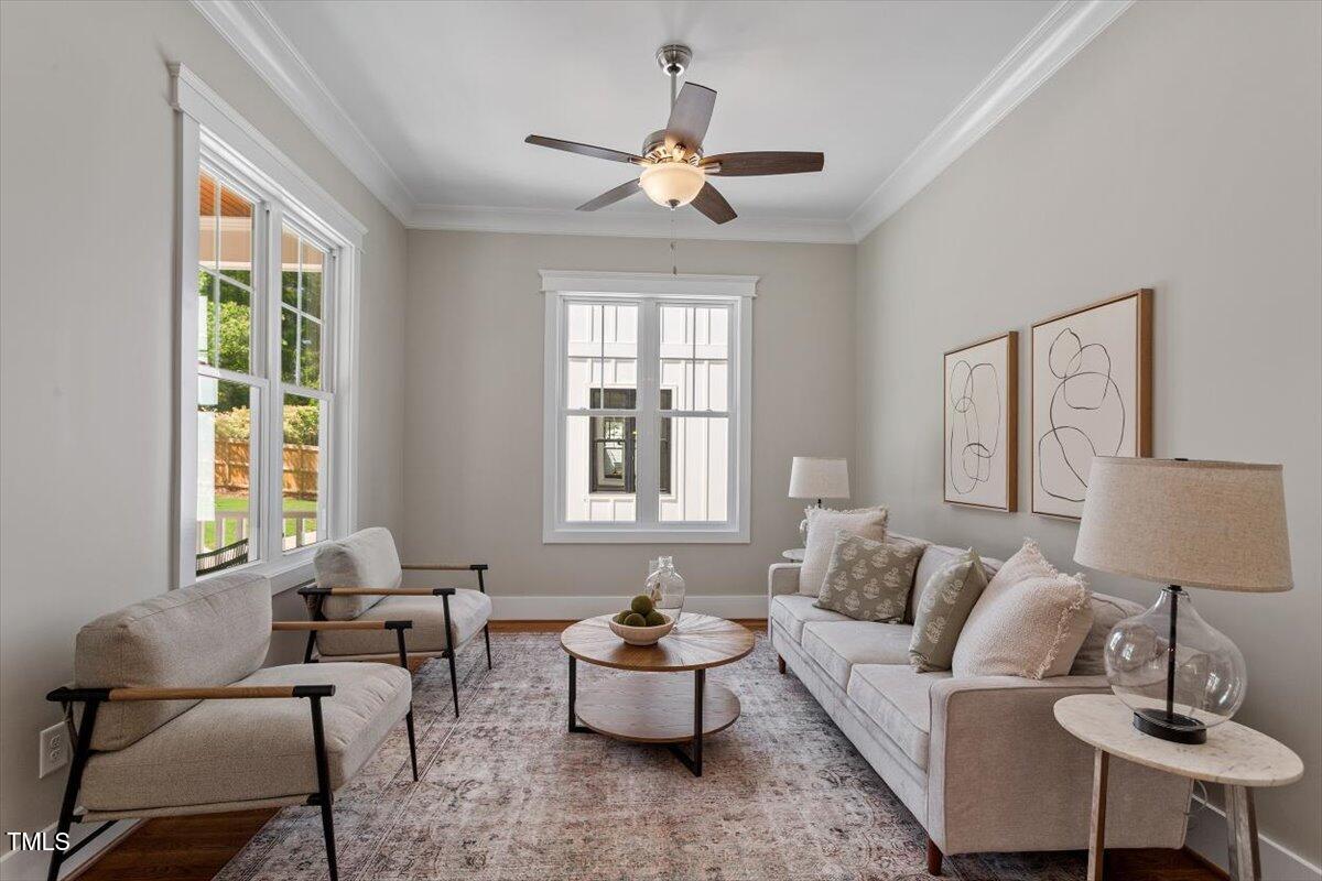 3932 Old Chapel Hill Road Durham, NC 27707 - Photo 11 of 46 a living room with furniture and a large window