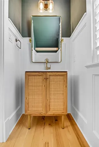 a view of a room with wooden floor and windows