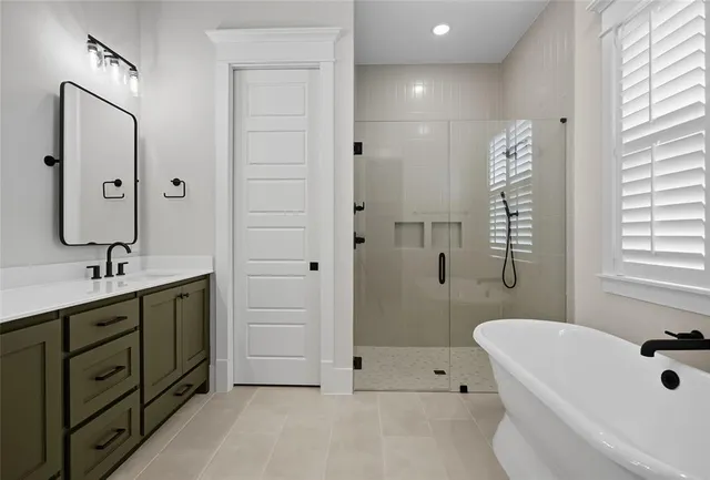 a bathroom with double sink and a mirror
