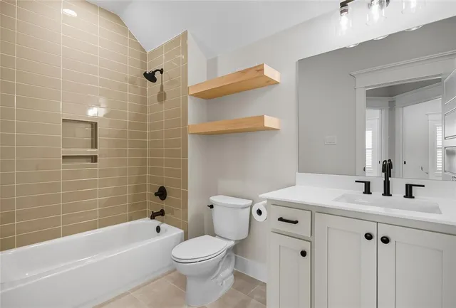 a view of a livingroom with a ceiling fan and window