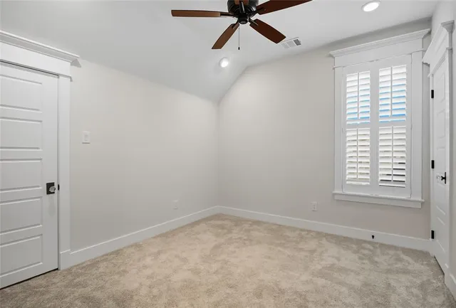 a view of a hallway with windows