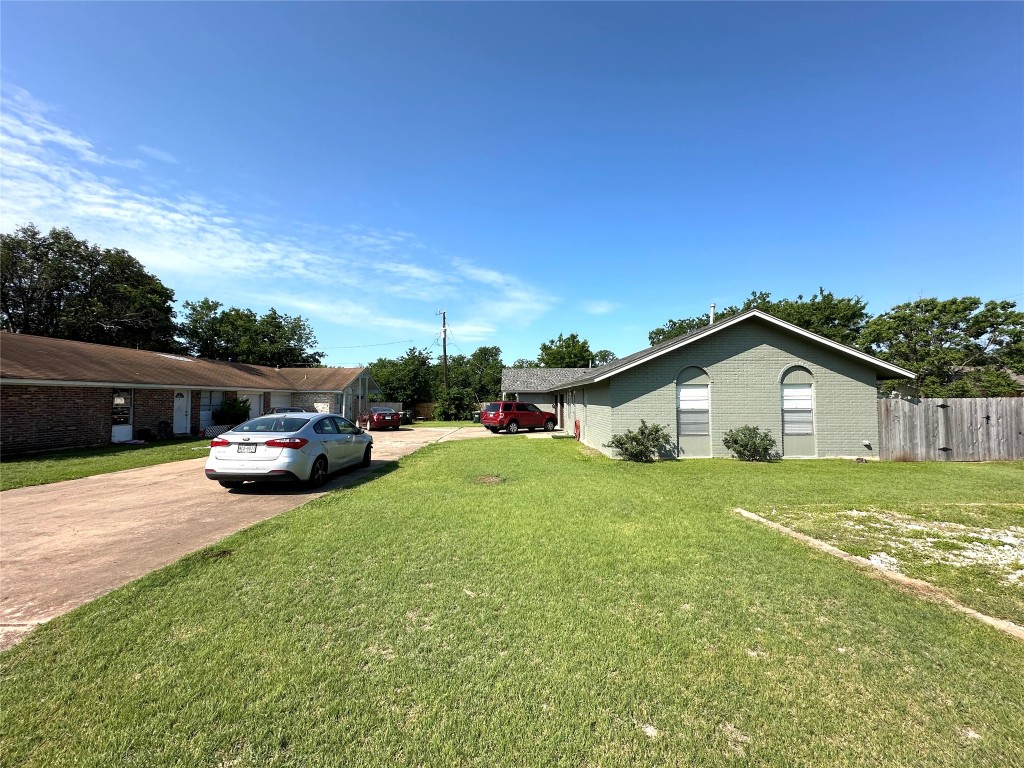2402 Parker Circle Georgetown, TX 78628 - Photo 1 of 1 a view of a house with a back yard