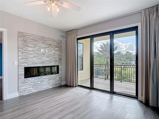 a kitchen with stainless steel appliances white cabinets a stove a sink and a microwave