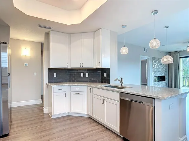 a kitchen with a stove and a microwave