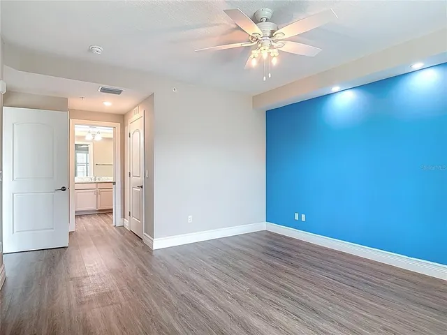 a bathroom with a granite countertop sink a large mirror and vanity