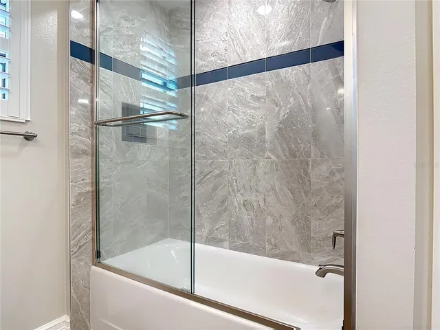 a view of a building with a garden and sitting area