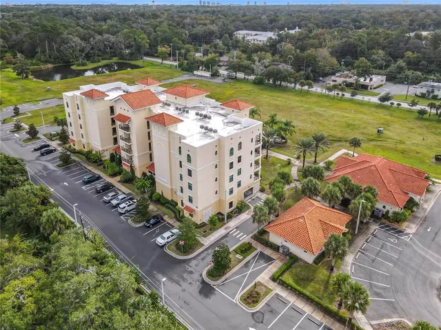 a front view of a residential apartment building with a yard