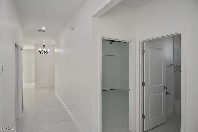 a bathroom with a shower and a glass door