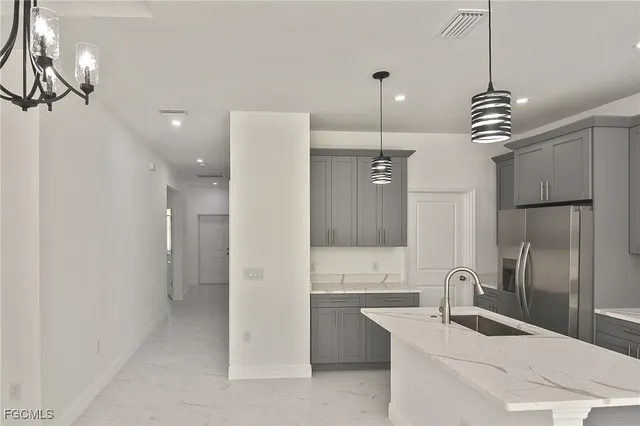 a bathroom with a sink a toilet a mirror and shower