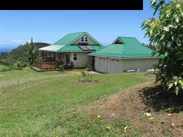 2415 Nehe Place Haiku, HI 96708 - Photo 3 of 22 a front view of a house with garden
