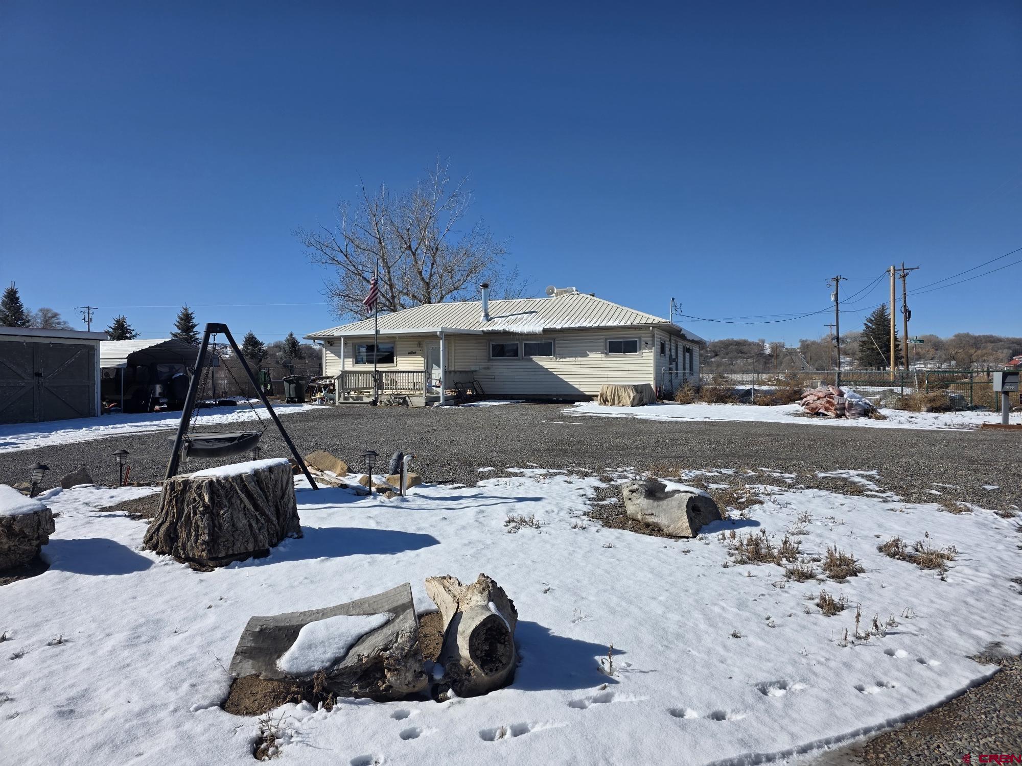 62500 Lasalle Road Montrose, CO 81403 - Photo 1 of 15 a view of a backyard with a table and chairs