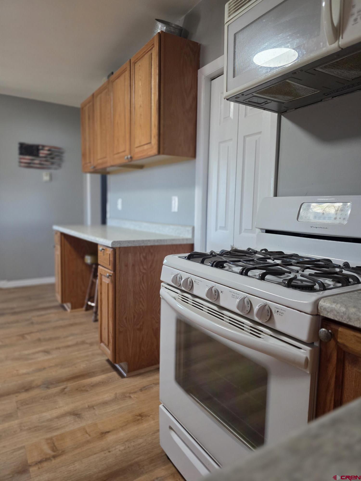 62500 Lasalle Road Montrose, CO 81403 - Photo 11 of 15 a stove top oven sitting inside of a kitchen
