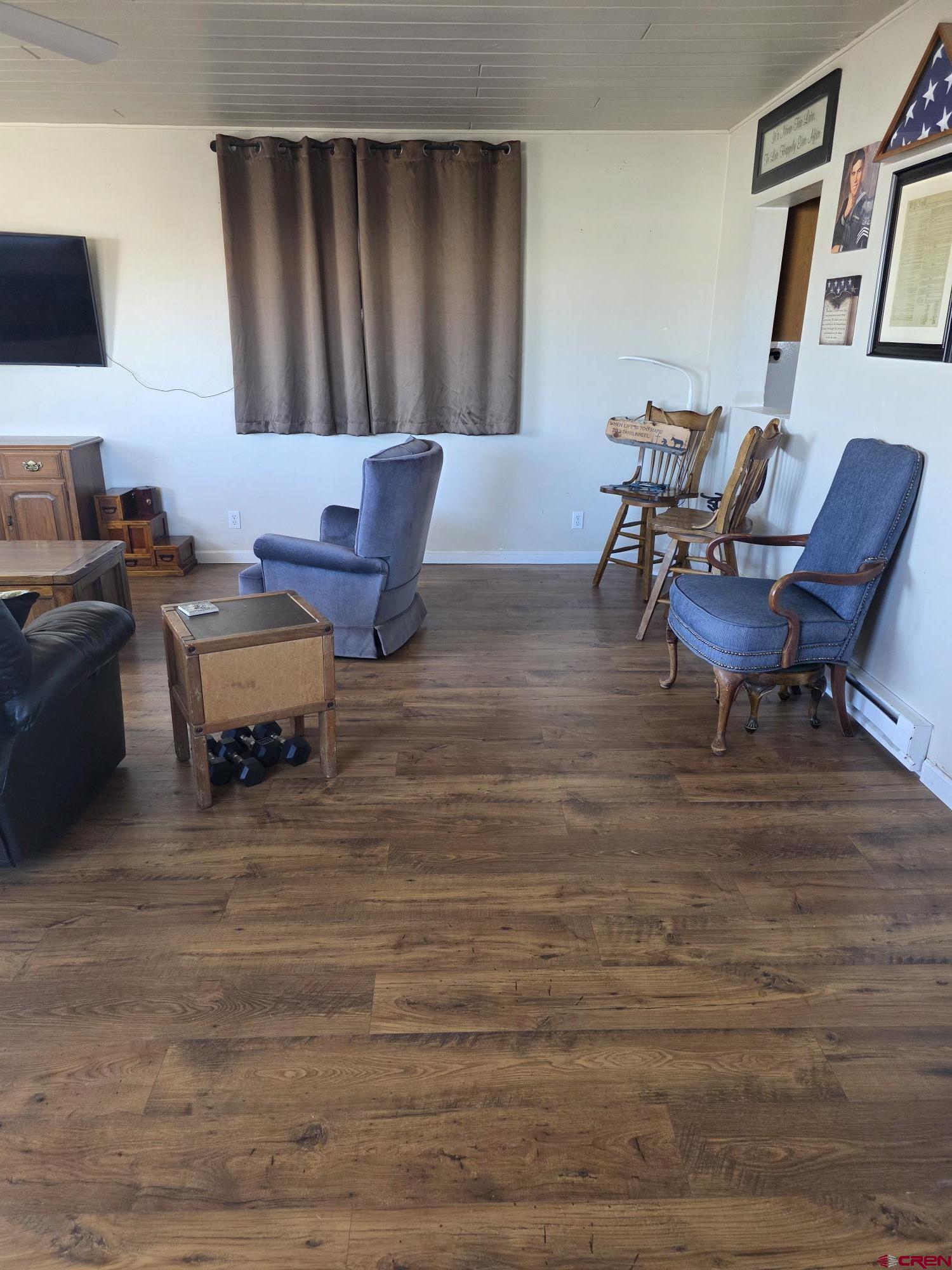 62500 Lasalle Road Montrose, CO 81403 - Photo 7 of 15 a living room with furniture and a wooden floor