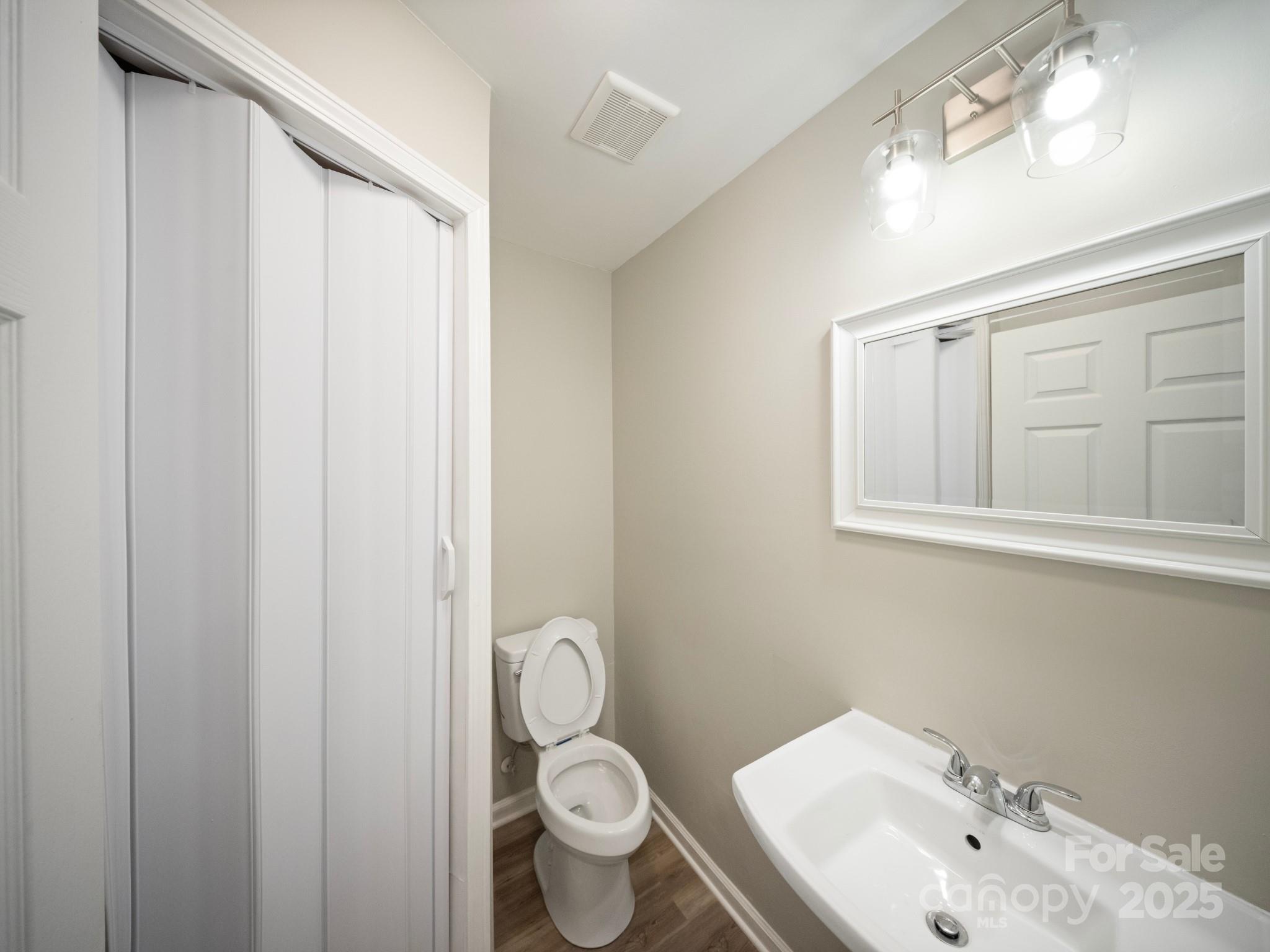 552 Locust Street Rock Hill, SC 29730 - Photo 15 of 24 a bathroom with a toilet and a sink