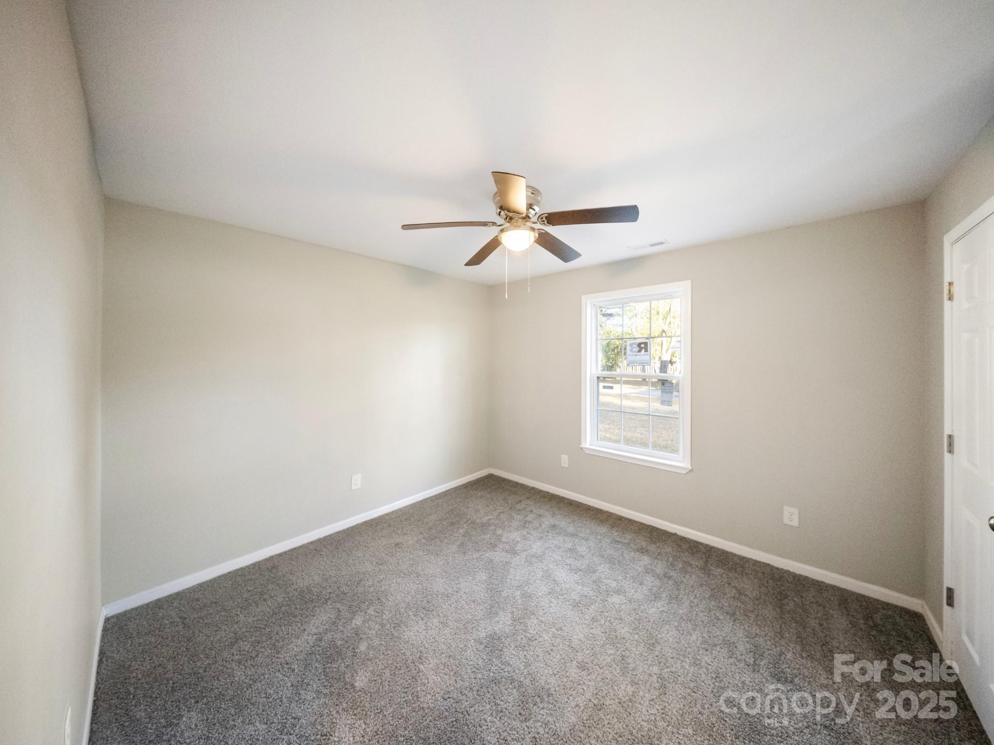 552 Locust Street Rock Hill, SC 29730 - Photo 17 of 24 a view of a livingroom with a ceiling fan and window
