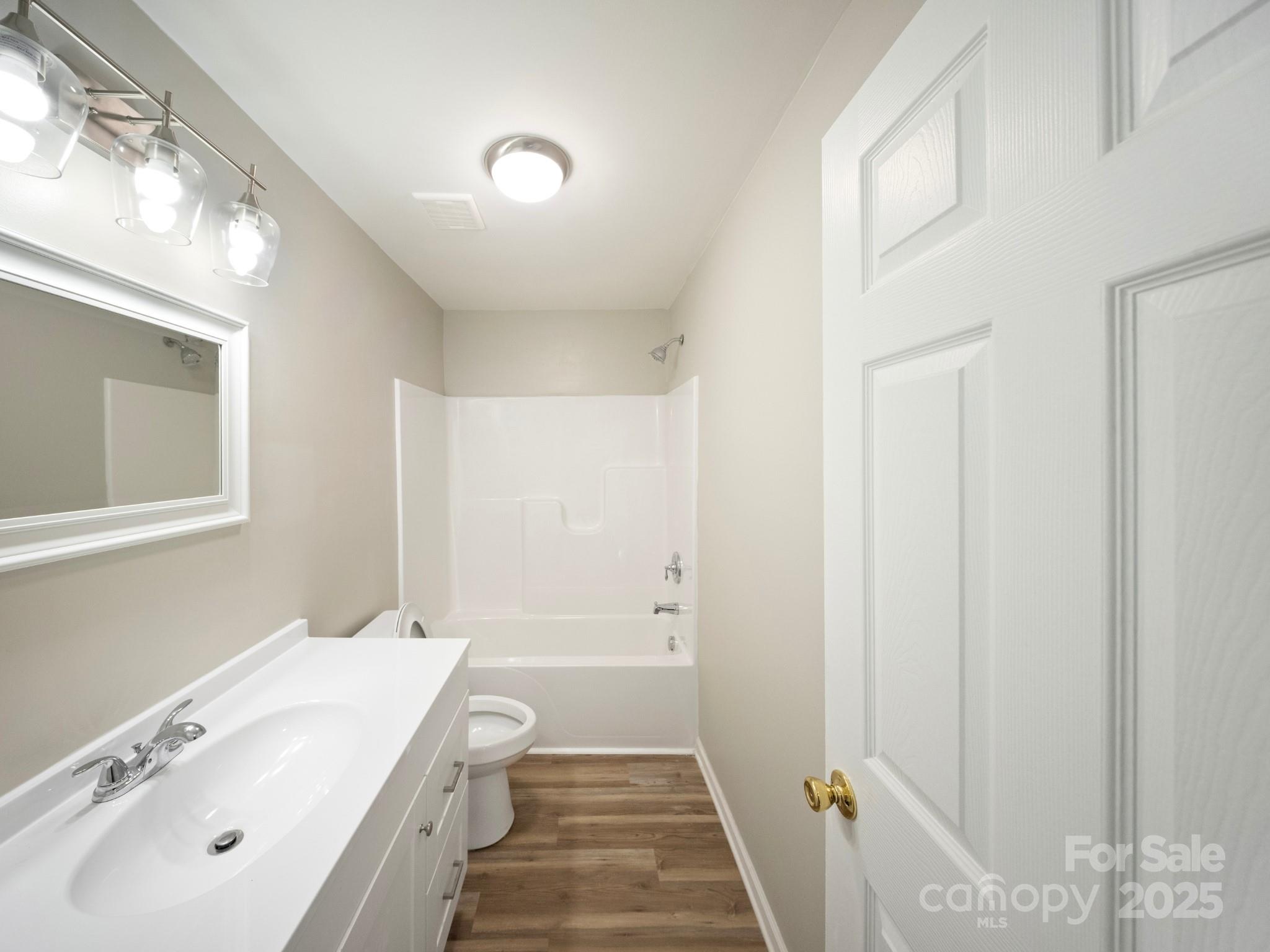 552 Locust Street Rock Hill, SC 29730 - Photo 18 of 24 a bathroom with a tub sink and mirror
