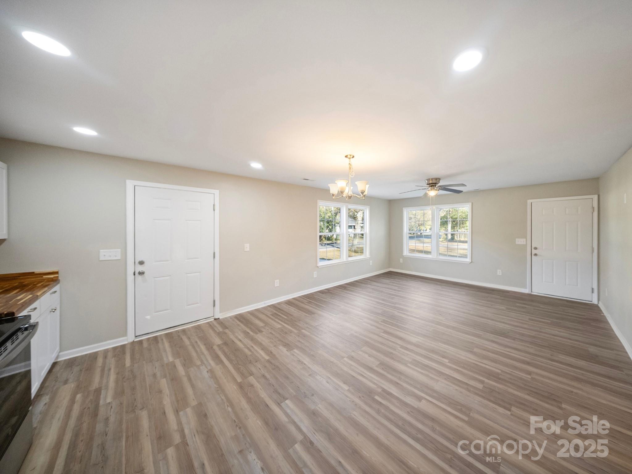 552 Locust Street Rock Hill, SC 29730 - Photo 4 of 24 an empty room with windows and entrance