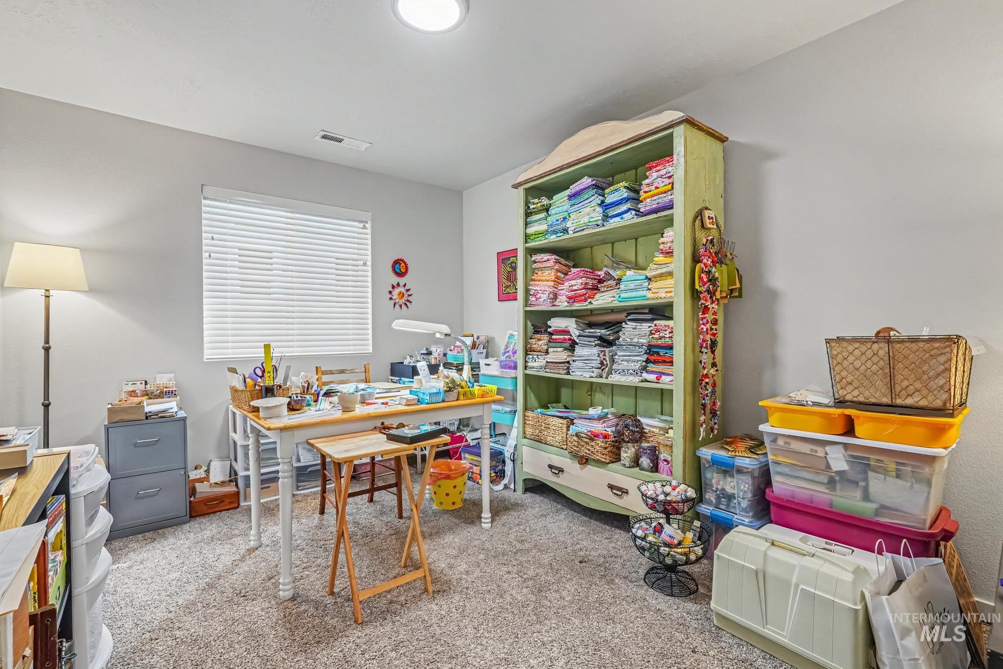 238 West Riggs Spring Avenue Meridian, ID 83642 - Photo 15 of 16 Recessed ceiling lighting, light gray wall paint, window with horizontal blinds, and carpeting