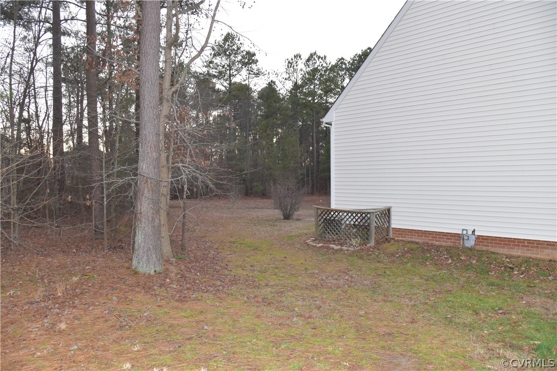 3051 Kinvan Road Henrico, VA 23231 - Photo 3 of 38 a backyard of a house with table and chairs