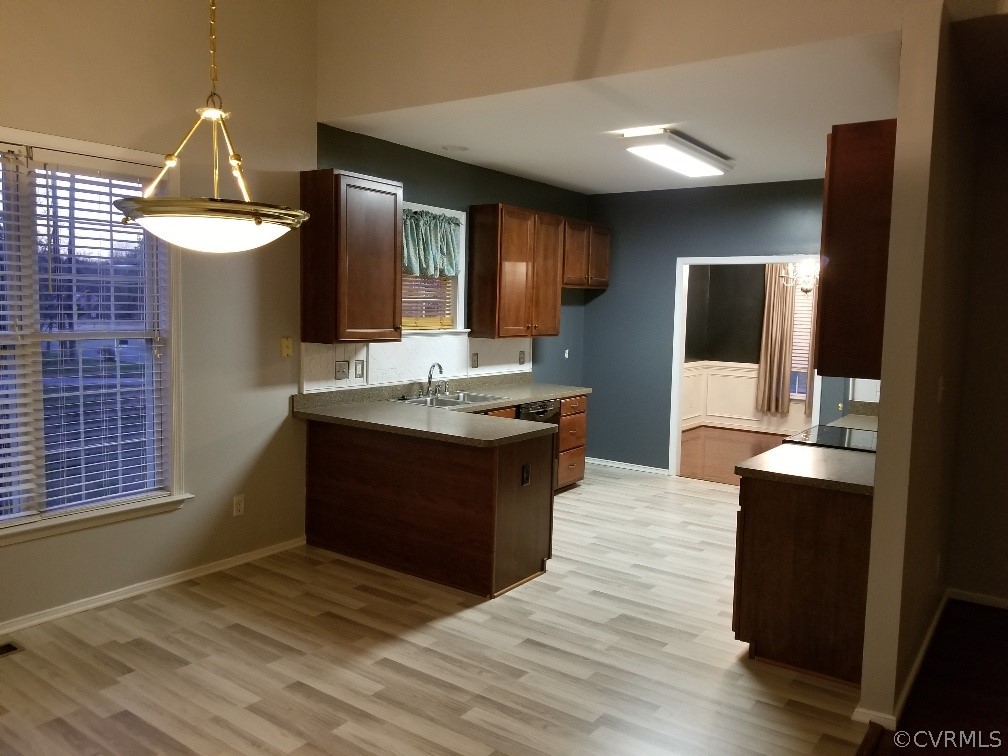 3051 Kinvan Road Henrico, VA 23231 - Photo 8 of 38 a kitchen with a sink cabinets and wooden floor