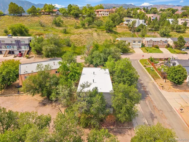an aerial view of residential building with parking space