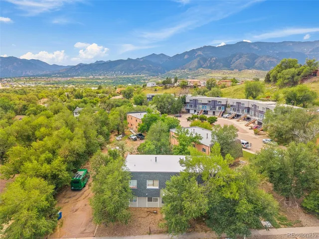 a view of a city with a lake