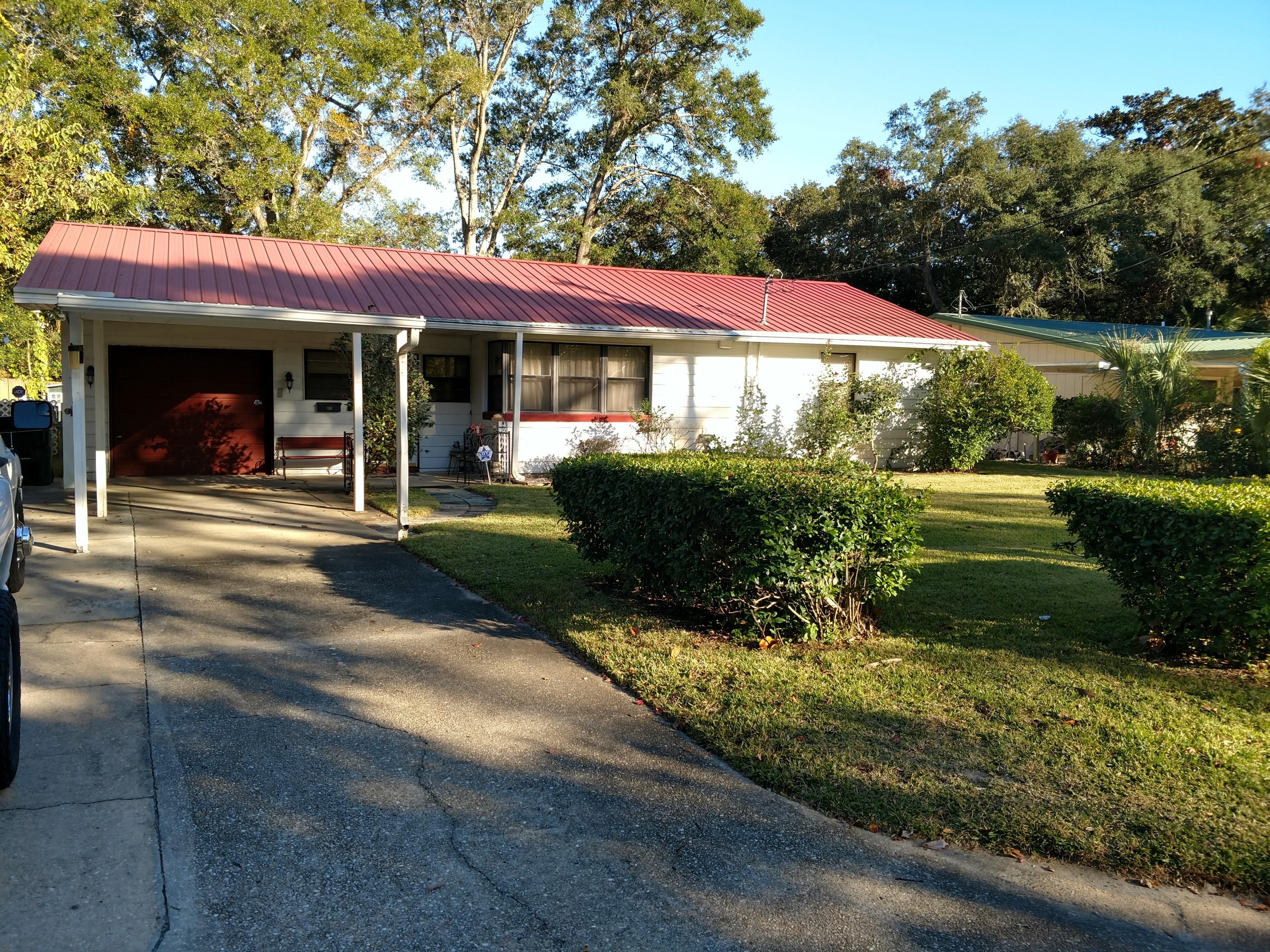 27 Choctawhatchee Road Southeast Fort Walton Beach, FL 32548 - Photo 1 of 20 a front view of a house with garden