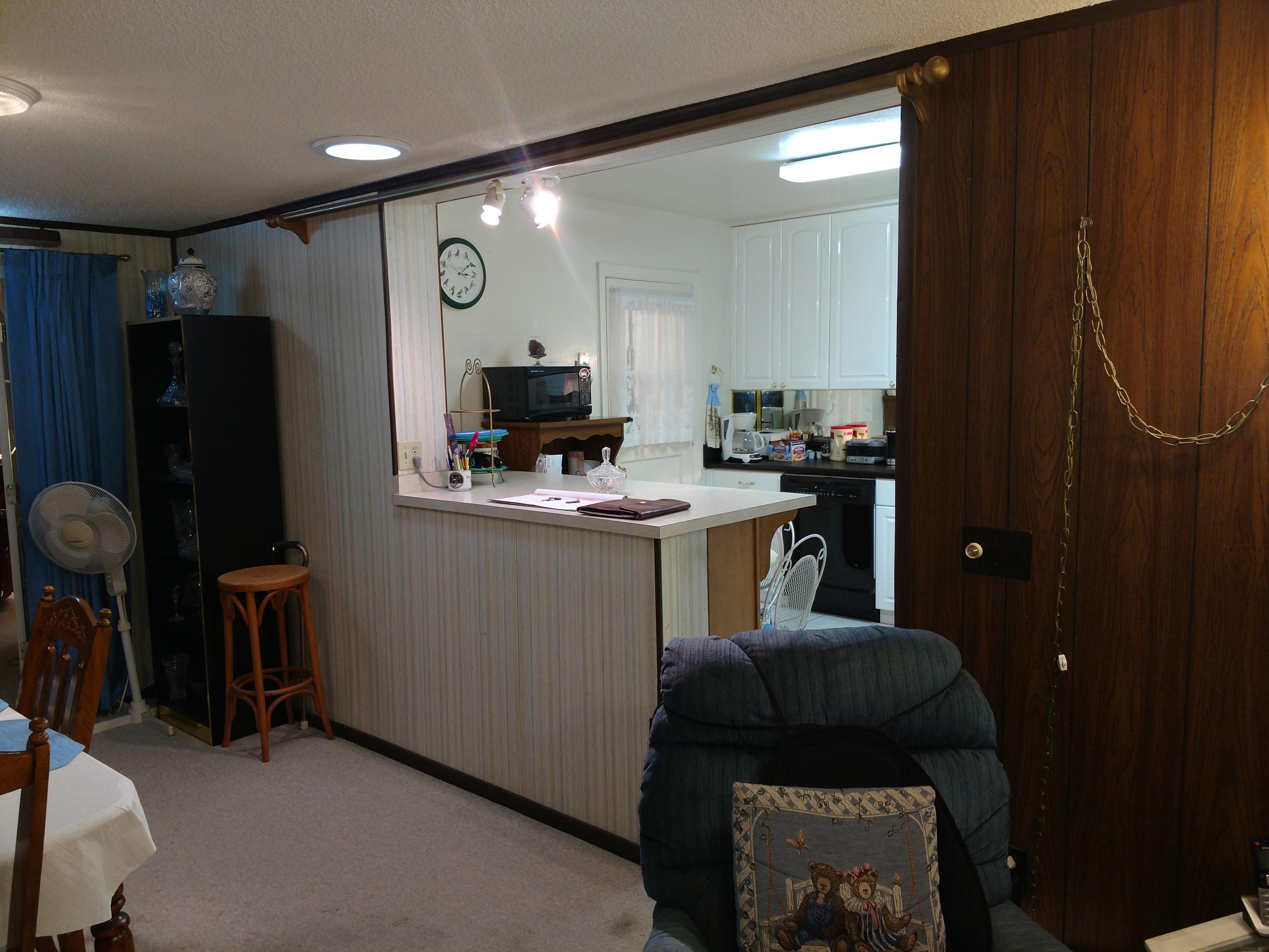 27 Choctawhatchee Road Southeast Fort Walton Beach, FL 32548 - Photo 11 of 20 a kitchen with a refrigerator and a sink