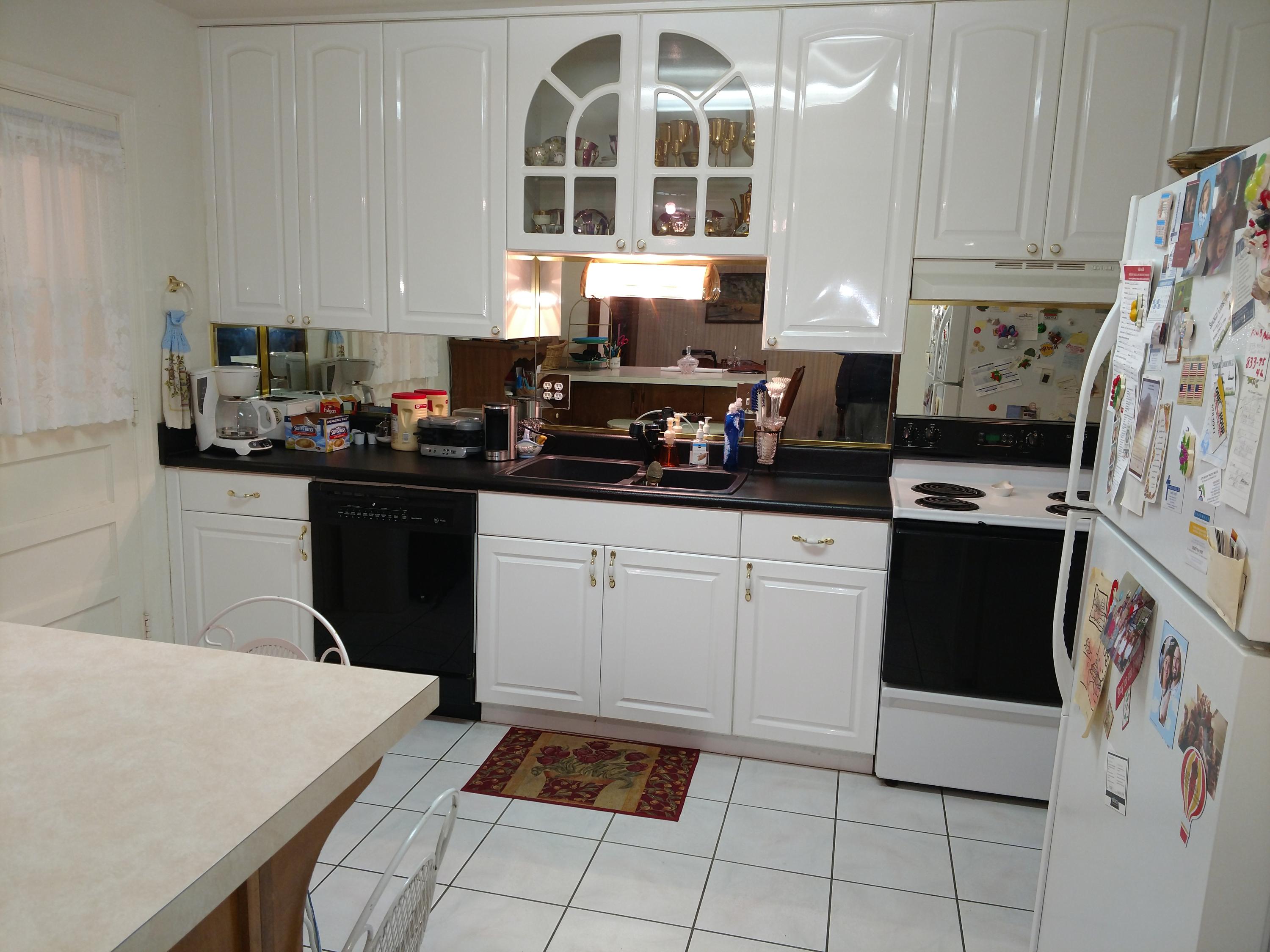 27 Choctawhatchee Road Southeast Fort Walton Beach, FL 32548 - Photo 12 of 20 a kitchen with stainless steel appliances a stove a sink a refrigerator a microwave and cabinets